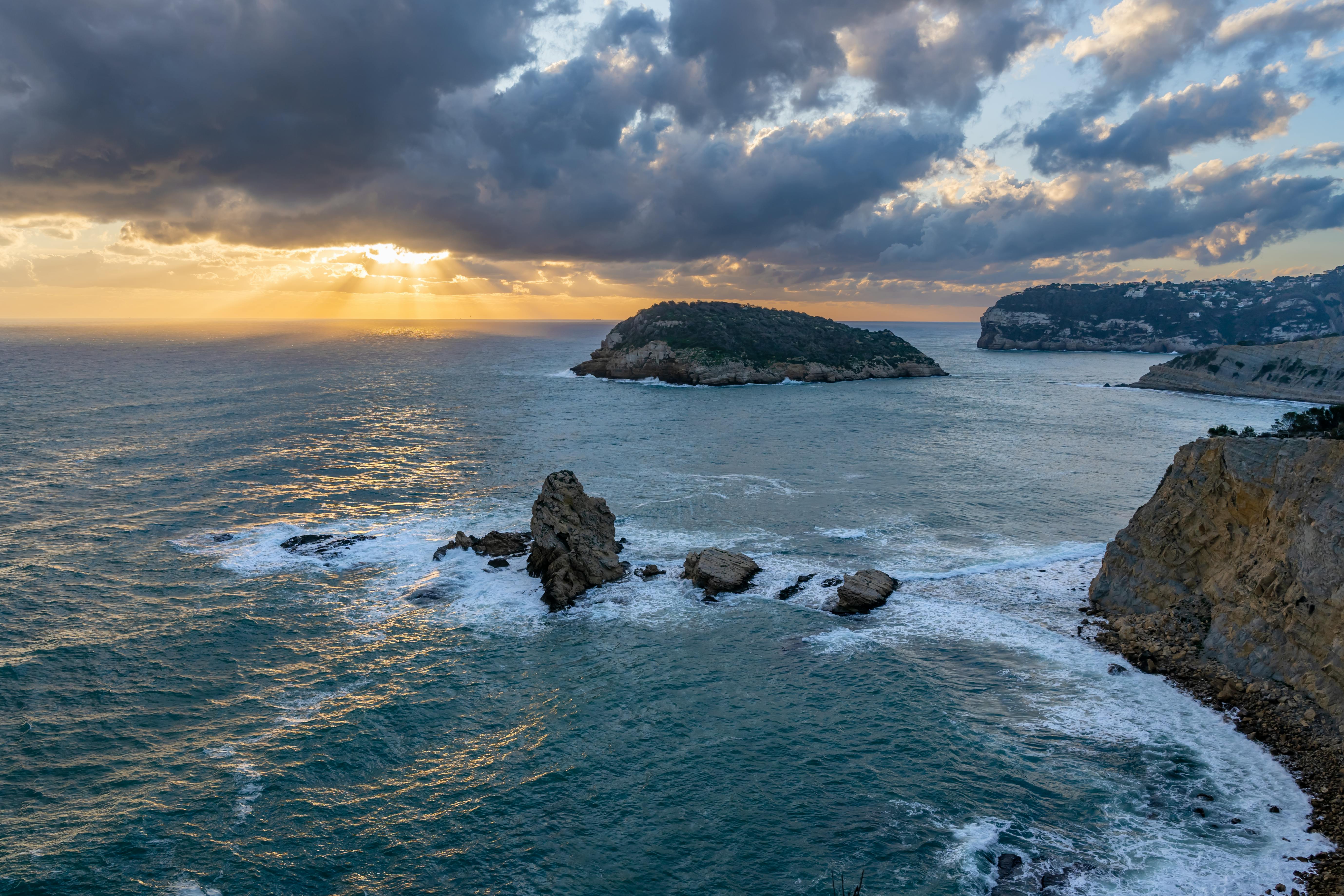 Cliffs of the Xàbia coast at sunset with the Mediterranean in the foreground, views from the Mirador de la Falzia in the Valencian Community