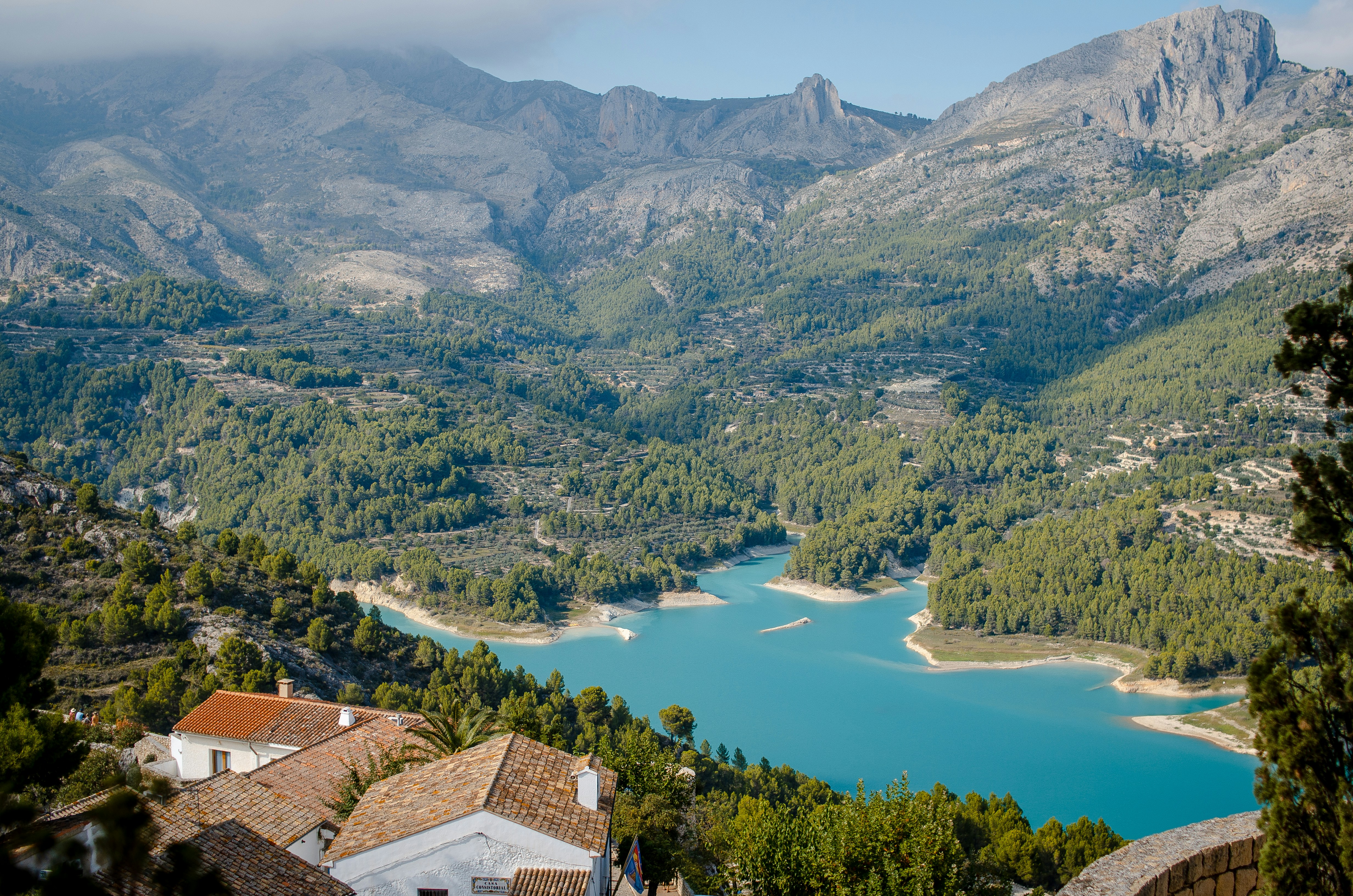 View of the Guadalest reservoir with turquoise waters from the village, accessible only by road from Benidorm